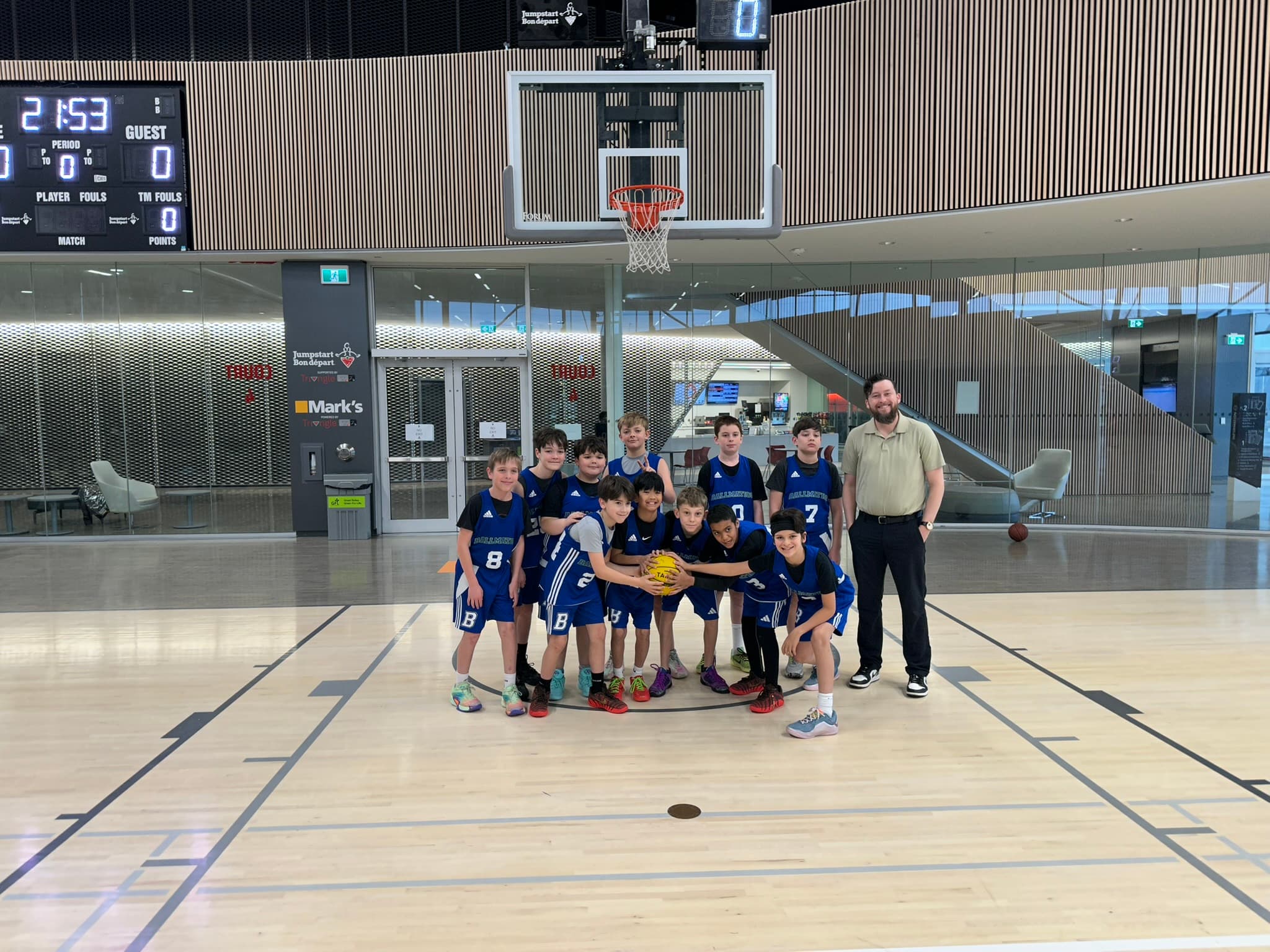 Coach Nolan with athletes on the court